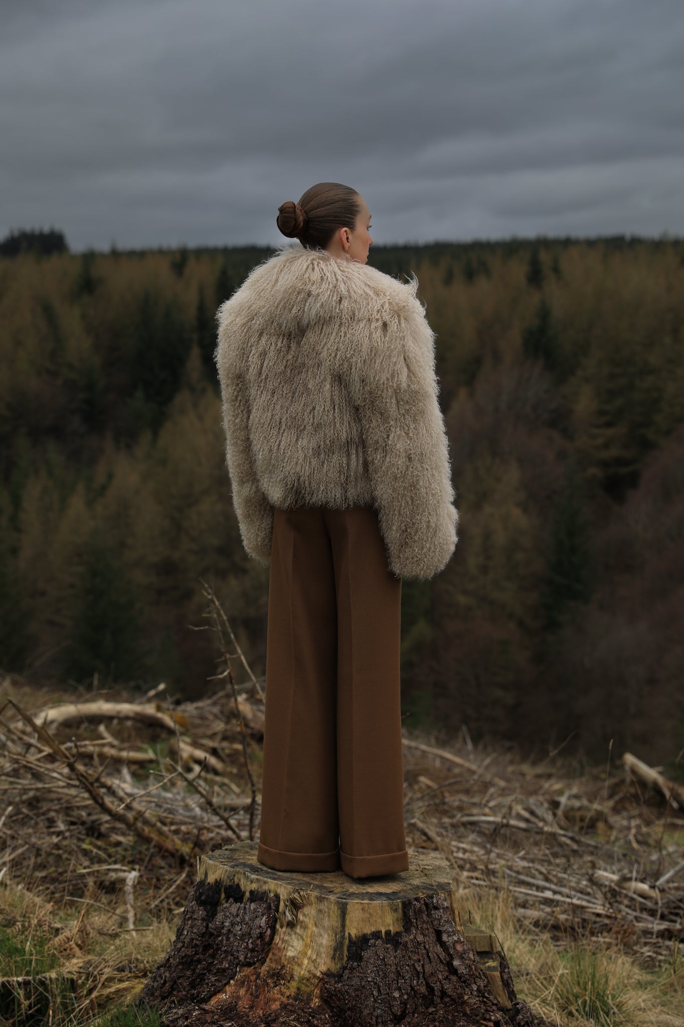 A timeless beige Mongolian fur coat with a voluminous collar, a classic staple piece from Josephine Jones, exuding elegance and sophistication.