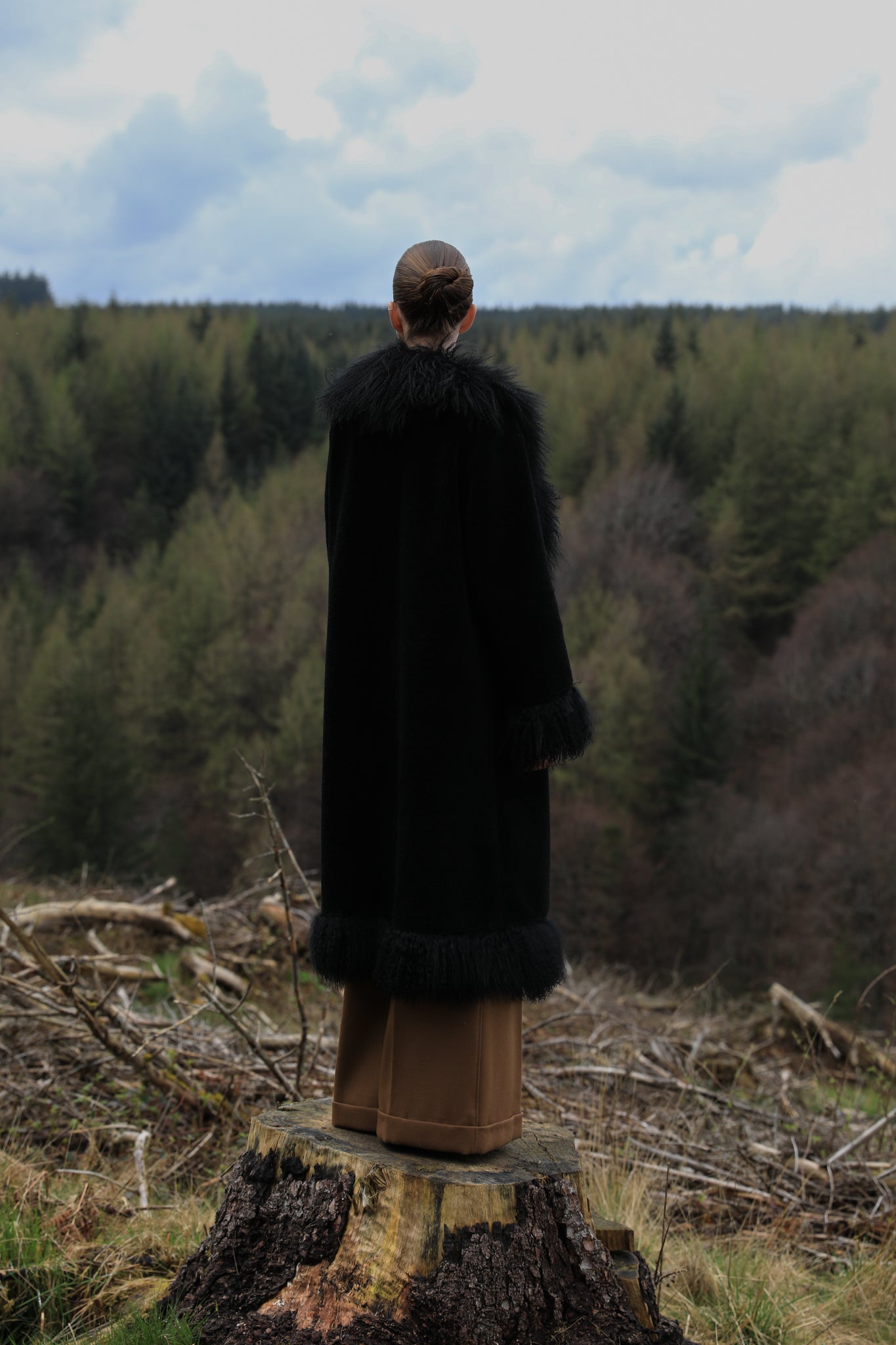 Black long genuine shearling coat with Mongolian fur trims from Josephine Jones - A bestselling luxury outerwear piece exuding elegance and warmth.